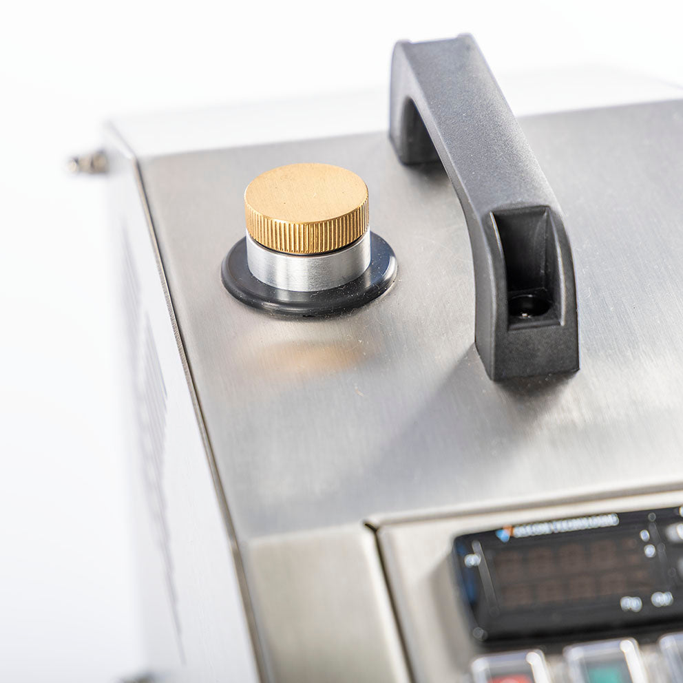 Scirocco smoke generator with CO₂ cylinder and smoke oil canister on a white background